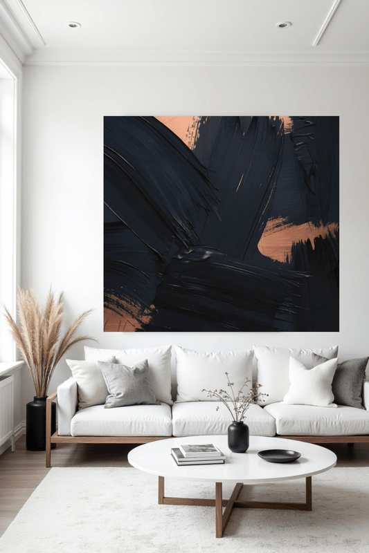 Modern living room with a white sofa, coffee table, and abstract art on the wall.